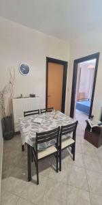 a table and chairs in a living room at Retas apartment in Kremasti