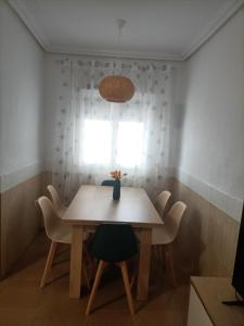 a table and chairs in a room with a window at Mi Casita del Cabo in El Cabo de Gata
