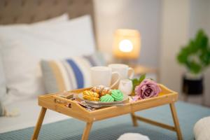 a coffee table with a tray of food on it at Charavgi apartment 2 in Kremasti