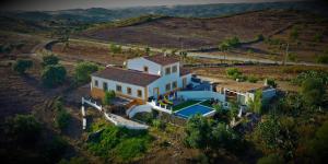 an aerial view of a house with a pool at Varandas do Vale Furnazinhas in Castro Marim