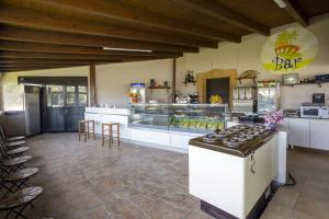 a large kitchen with a stove and a counter at Oasi lamia - 3 in Mazara del Vallo