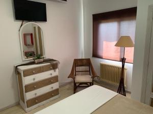Кровать или кровати в номере Apartamentos en Playa de Samil Primera Línea de playa Pe Na Areia