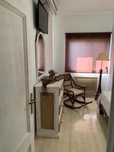 Телевизор и/или развлекательный центр в Apartamentos en Playa de Samil Primera Línea de playa Pe Na Areia