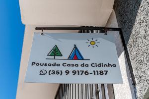 a sign for a pueblo casa de ghalsein at Casa da Cidinha in Extrema
