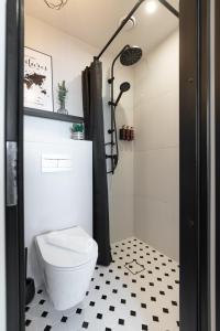 a bathroom with a toilet and a shower at Tempus Te Avangard Tallinn with terrace and gym in Tallinn +44 photos