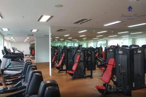 a gym with a lot of treadmills and ellipticals at 5mins to KLCC -Lvl32-2br-FreeParking in Kuala Lumpur