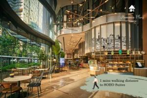 a rendering of the lobby of a building with tables and chairs at 5mins to KLCC -Lvl32-2br-FreeParking in Kuala Lumpur
