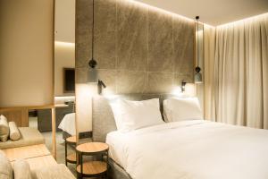 Posteľ alebo postele v izbe v ubytovaní KING MINOS RETREAT Resort & Spa