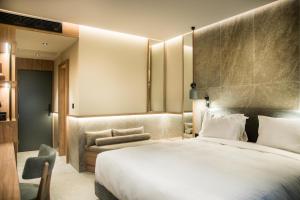 Posteľ alebo postele v izbe v ubytovaní KING MINOS RETREAT Resort & Spa
