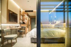Posteľ alebo postele v izbe v ubytovaní KING MINOS RETREAT Resort & Spa