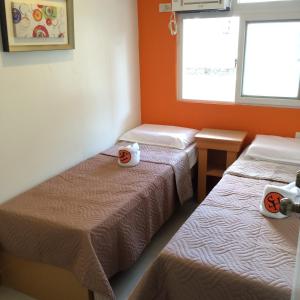 Postel nebo postele na pokoji v ubytování Stone House Hotel Pasay