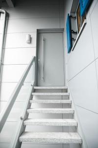 a staircase leading up to a door in a building at Apartment mit Burgblick in Burglengenfeld