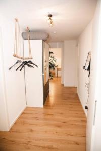 a hallway of an apartment with a wooden floor at Apartment mit Burgblick in Burglengenfeld