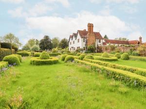 a large house with a garden in front of it at Shore Hall in Braintree