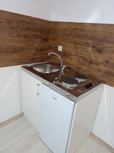 a kitchen with a sink and a counter top at Rooms Mario in Međugorje