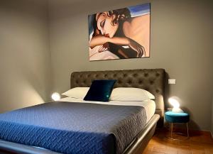 A bed or beds in a room at La Sosta in Toscana