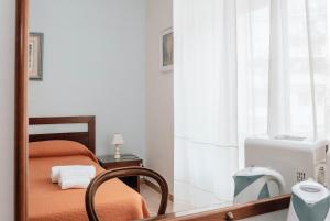 Postel nebo postele na pokoji v ubytování B&B La Formichella