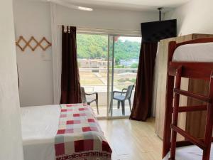 Postel nebo postele na pokoji v ubytování Bahia B&B
