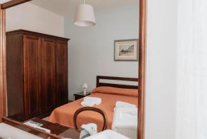 Postel nebo postele na pokoji v ubytování B&B La Formichella