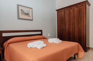 Postel nebo postele na pokoji v ubytování B&B La Formichella