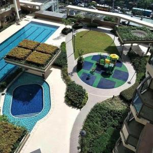 an overhead view of a swimming pool with a toy playground at The Radiance Manila Bay in Manila