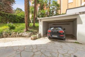 a car is parked inside of a garage at Olmo Suites in Como