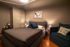 A bed or beds in a room at La Sosta in Toscana
