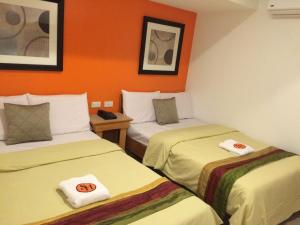 Postel nebo postele na pokoji v ubytování Stone House Hotel Pasay