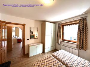 Postel nebo postele na pokoji v ubytování Appartamenti Florino di Silvestri Mariangela