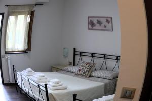 A bed or beds in a room at Villa Rosada