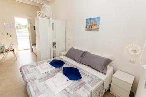 Postel nebo postele na pokoji v ubytování Perladelmare + 21 fotografií