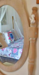 a reflection of a bed in a mirror at Holiday Oasis with private patio and Hammam-style bath in Chora-Pithagoreo, Samos Island in Chóra