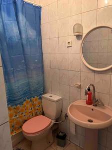 a bathroom with a toilet and a sink at Şehir Merkezinde Konforlu Daire in Istanbul