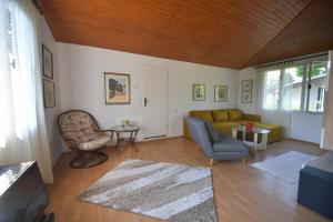 a living room with a couch and a chair at Danube River house in Novi Sad