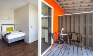 Posteľ alebo postele v izbe v ubytovaní Tisza-tó Apartmanpark
