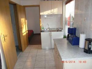 a kitchen with a sink and a counter top at Ruegen_Fewo 24 in Thesenvitz