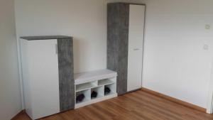 an empty room with a shelf and a closet at Ruegen_Fewo 259 in Berglase