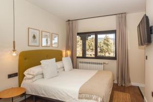 Postel nebo postele na pokoji v ubytování Duruelo Mountain Suites