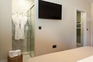 TV a/nebo společenská místnost v ubytování Duruelo Mountain Suites