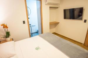 TV a/nebo společenská místnost v ubytování Vita Hotel Boutique