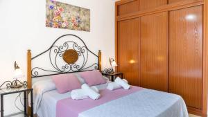 Postel nebo postele na pokoji v ubytování Home Victoria Playa Málaga