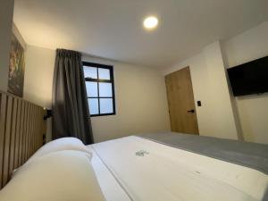Postel nebo postele na pokoji v ubytování Vita Hotel Boutique