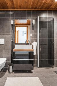 a bathroom with a sink and a shower at Åre's best family home in Åre
