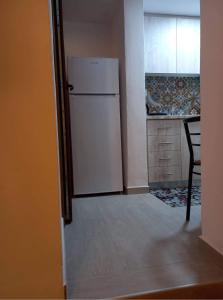 Kuchyň nebo kuchyňský kout v ubytování Rafailia's House