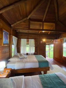 Cama o camas de una habitación en Galapagos Cabañas Eden