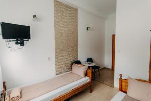 A television and/or entertainment centre at Palma Vendégház Még 37 kép
