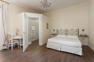 Postel nebo postele na pokoji v ubytování Borgo Prima Luce