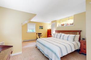 a bedroom with a bed and a dresser and a window at Sheridans Getaway in Newry