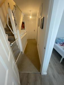 a hallway with stairs leading to a bedroom at Affordable single room 
