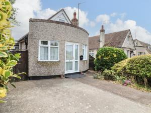 an exterior view of a house with a driveway at 21 Crossways in Clacton-on-Sea